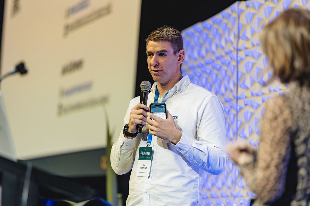 Joe Sutheran presenting on practical AI at the Seafood New Zealand 2026 Conference
